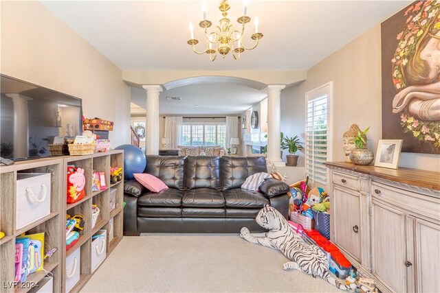 1819 Wild Indigo Ct, Las Vegas, NV 89123 - carpeted living area with decorative columns, arched walkways, and a chandelier