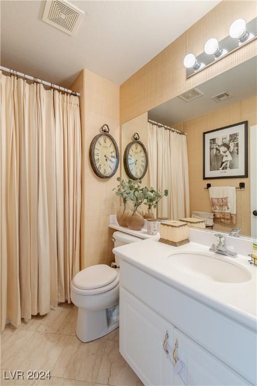 1819 Wild Indigo Ct, Las Vegas, NV 89123 - full bathroom with wallpapered walls, vanity, marble finish flooring, and a shower with curtain
