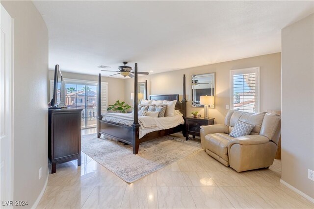 1819 Wild Indigo Ct, Las Vegas, NV 89123 - bedroom with multiple windows, a ceiling fan, light marble finish floors, and arched walkways
