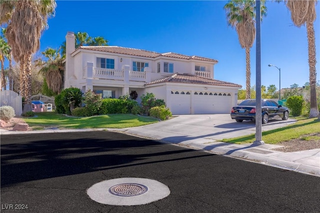 1819 Wild Indigo Ct, Las Vegas, NV 89123 - mediterranean / spanish house with a chimney, a tile roof, a balcony, and stucco siding