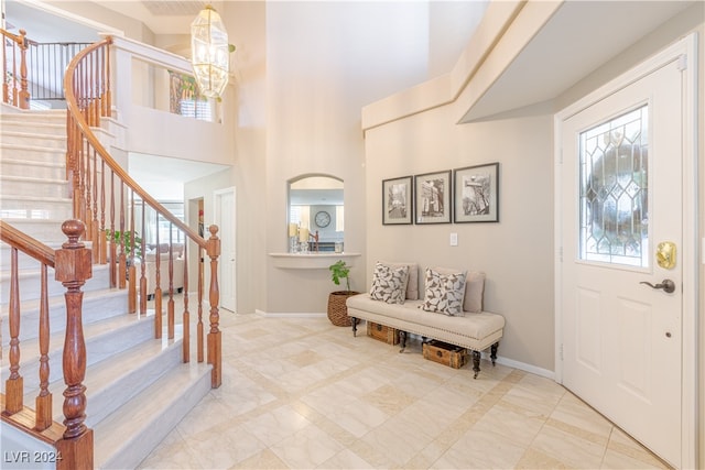 entrance foyer with a high ceiling and an inviting chandelier