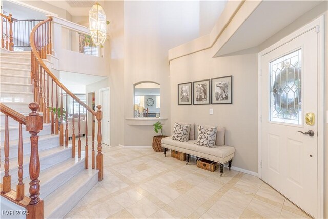1819 Wild Indigo Ct, Las Vegas, NV 89123 - foyer entrance with stairs, a towering ceiling, and a chandelier