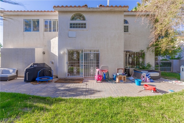 back of house with a patio