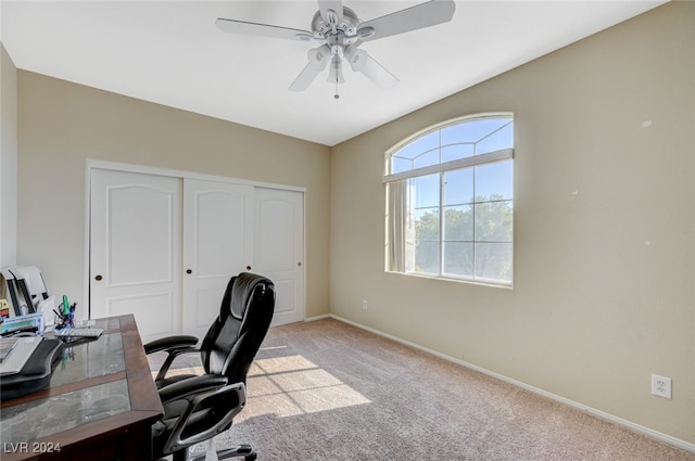 office space with light carpet and ceiling fan