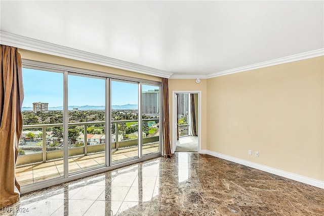 unfurnished room featuring a mountain view and crown molding