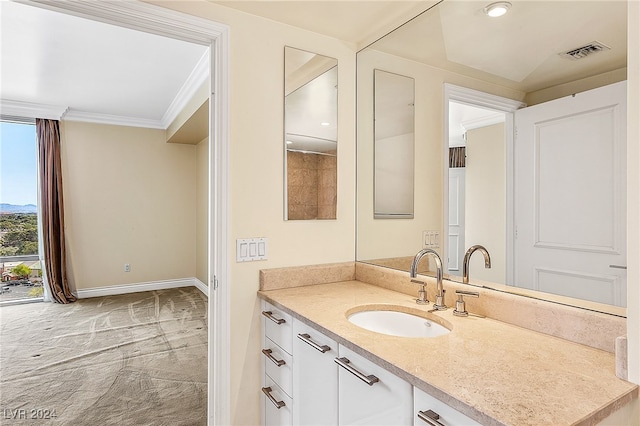 bathroom with vanity and ornamental molding