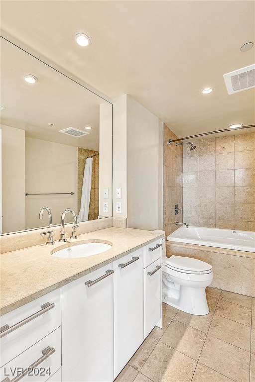 full bathroom with toilet, shower / bath combination with curtain, vanity, and tile patterned floors