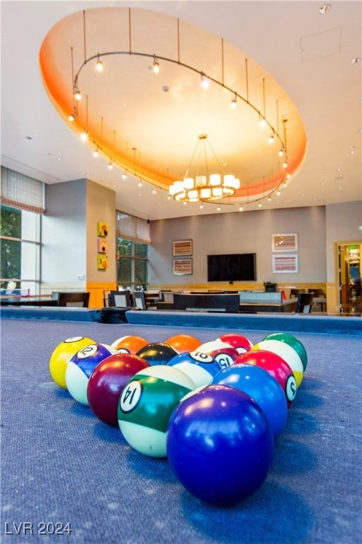 interior space with carpet and a raised ceiling