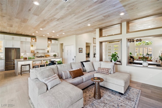 living room featuring wood ceiling and light wood-type flooring