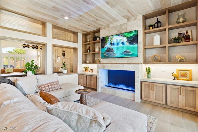 living room with a fireplace, wooden ceiling, built in features, and light hardwood / wood-style floors