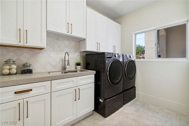 laundry room with washer and dryer, cabinets, light tile patterned floors, and sink