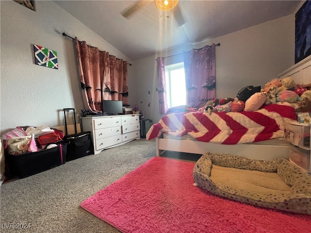 bedroom with carpet flooring, vaulted ceiling, and ceiling fan