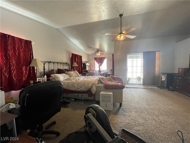 bedroom featuring carpet flooring, ceiling fan, a textured ceiling, and vaulted ceiling