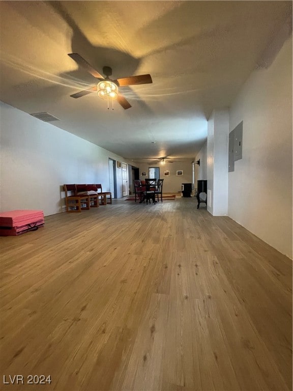 interior space with hardwood / wood-style floors and electric panel