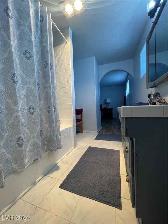 bathroom featuring vanity and shower / tub combo