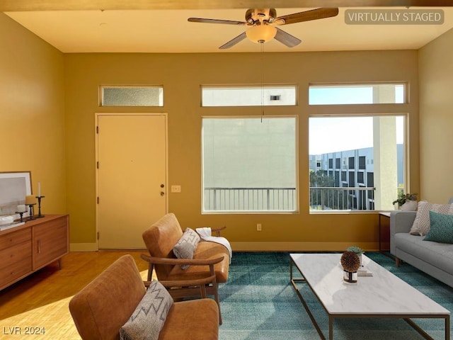2715 W Pebble Rd Unit 505, Las Vegas, NV 89123 - living room featuring ceiling fan, wood finished floors, and baseboards