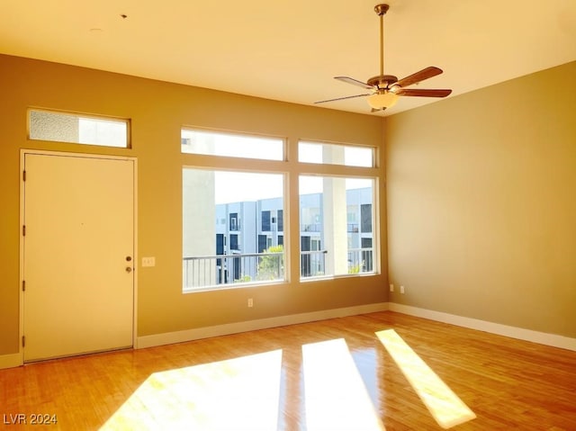 interior space with ceiling fan and light wood-type flooring