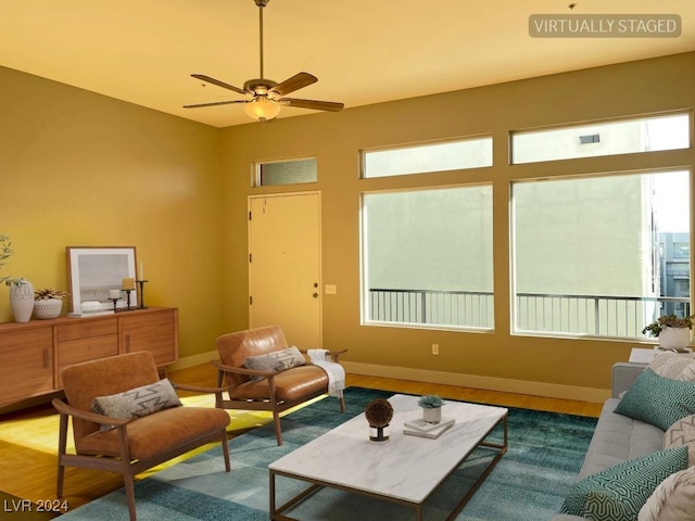 interior space with ceiling fan and wood-type flooring