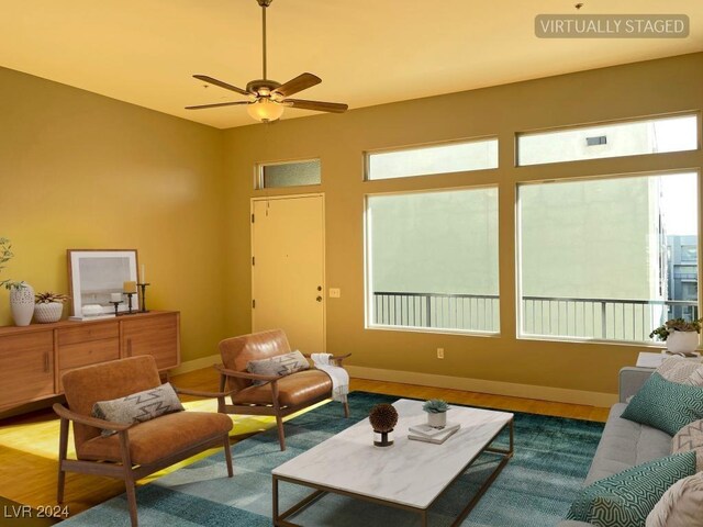 2715 W Pebble Rd Unit 505, Las Vegas, NV 89123 - living room with ceiling fan, baseboards, and wood finished floors