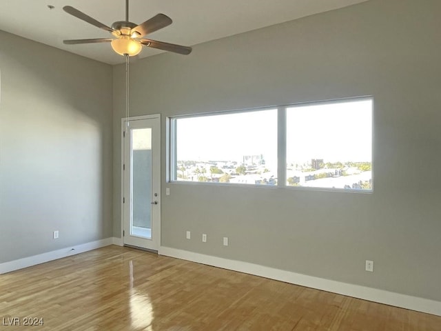 unfurnished room featuring ceiling fan and light hardwood / wood-style floors