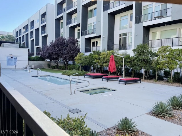 view of pool featuring a hot tub