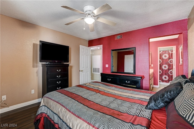 bedroom with a textured ceiling, ceiling fan, and dark hardwood / wood-style floors