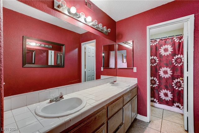 bathroom featuring tile patterned floors and vanity