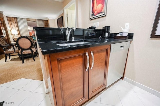 145 Harmon Ave Unit 208, Las Vegas, NV 89109 - kitchen with dishwasher, a sink, brown cabinets, dark countertops, and ornamental molding