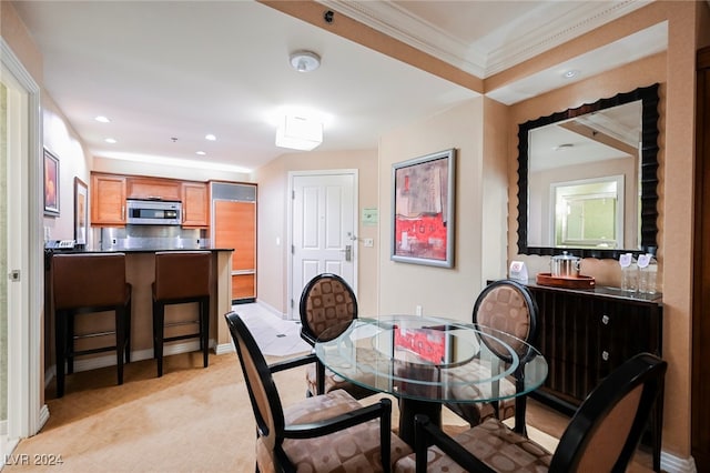 dining area featuring crown molding