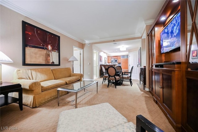 145 Harmon Ave Unit 208, Las Vegas, NV 89109 - living room with crown molding, light carpet, and baseboards