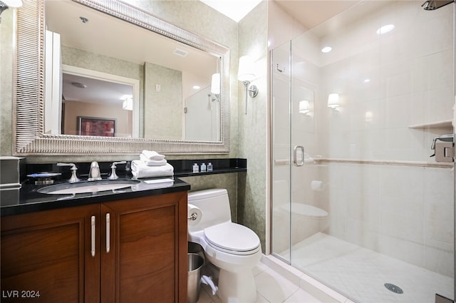 bathroom featuring walk in shower, tile patterned flooring, toilet, vanity, and tile walls