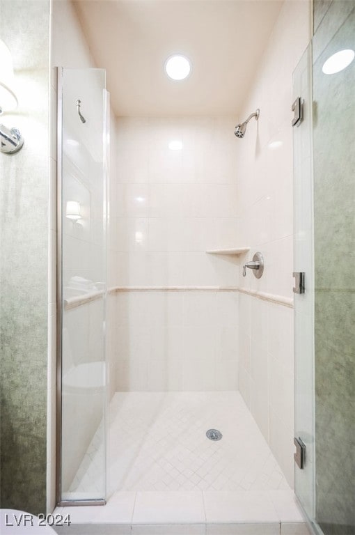 bathroom with an enclosed shower