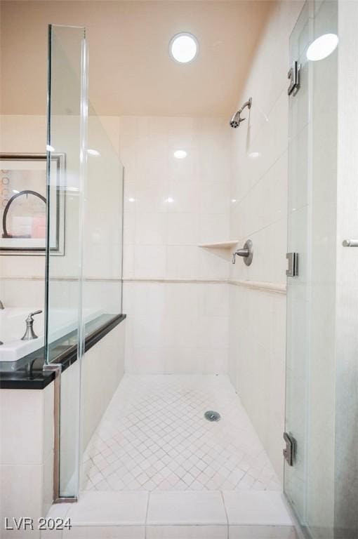 145 Harmon Ave Unit 208, Las Vegas, NV 89109 - bathroom featuring a stall shower and a sink
