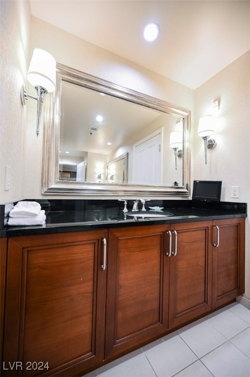 bathroom with tile patterned floors and vanity