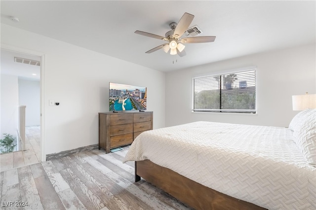 bedroom featuring ceiling fan and light wood-type flooring