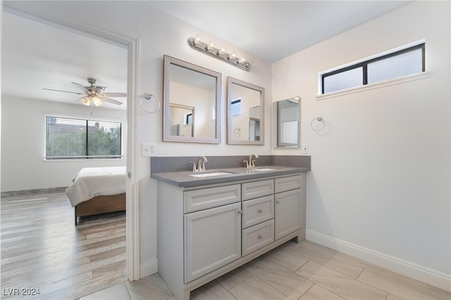 bathroom featuring hardwood / wood-style floors, vanity, and ceiling fan