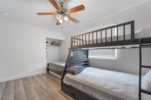 bedroom with light hardwood / wood-style flooring and ceiling fan