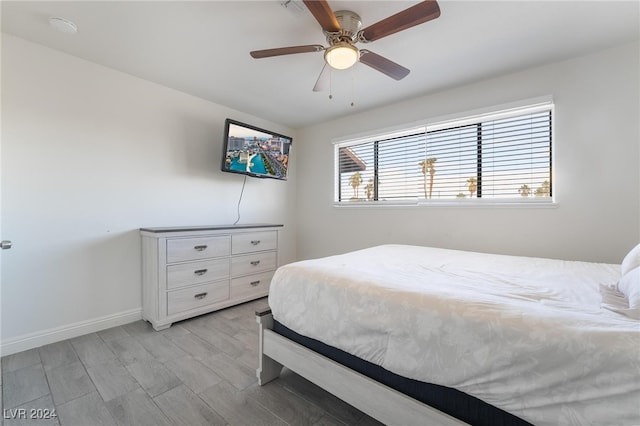 bedroom featuring light hardwood / wood-style flooring and ceiling fan