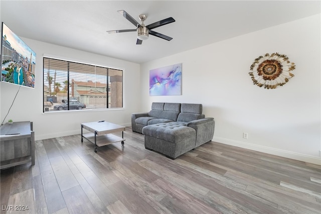 living room with hardwood / wood-style flooring and ceiling fan