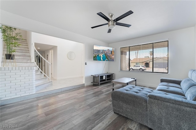 living room featuring hardwood / wood-style flooring and ceiling fan