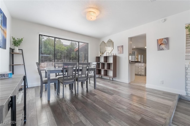 dining area with wood-type flooring