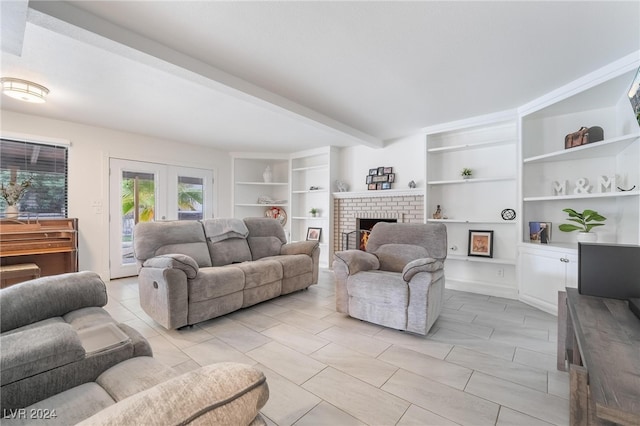 tiled living room with beam ceiling, french doors, built in features, and a brick fireplace