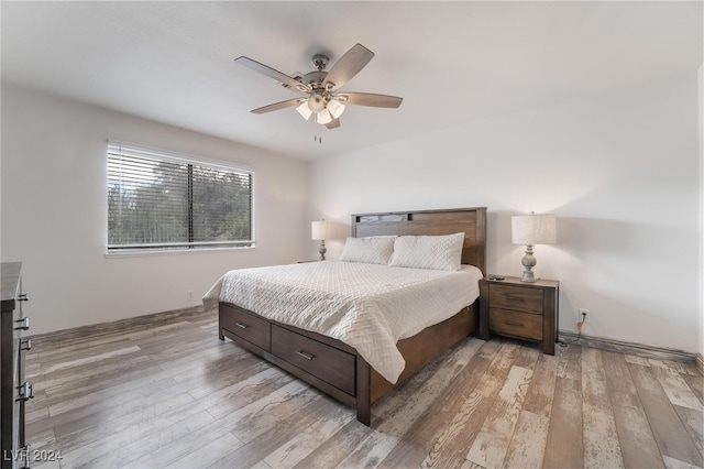 bedroom with ceiling fan and light wood-type flooring