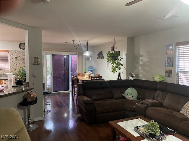 living room with dark hardwood / wood-style flooring