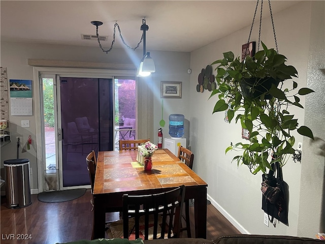 dining space featuring dark hardwood / wood-style flooring