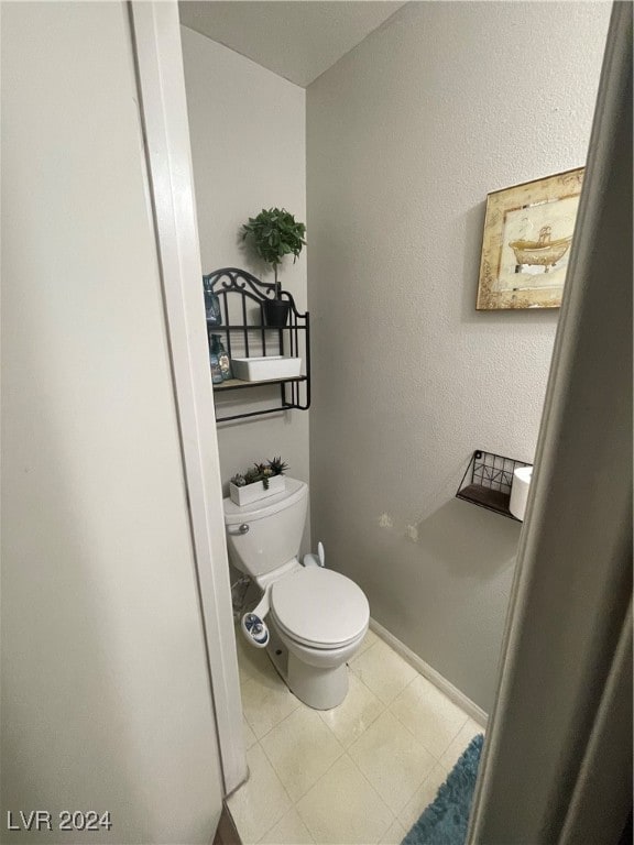 bathroom featuring tile patterned floors and toilet