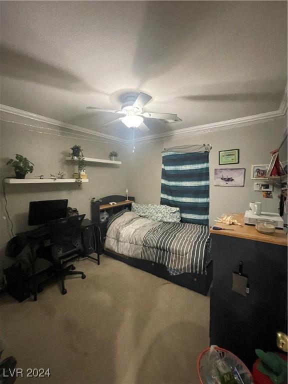 bedroom with carpet floors, ceiling fan, and crown molding