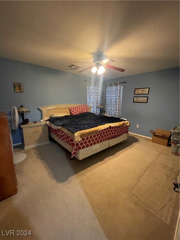 bedroom with ceiling fan and carpet