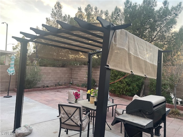 view of patio with a pergola and area for grilling