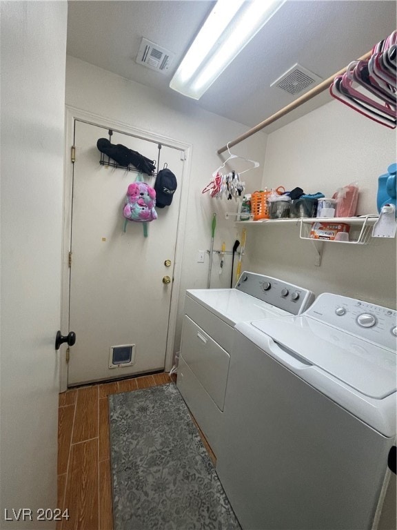 washroom featuring washing machine and clothes dryer